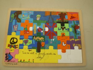 As part of a school auction I had my students create mixed media heritage puzzles. Heritage was the school wide theme. Each student designed a section of the puzzle. We were inspired by our individual family heritage as well as our school community.